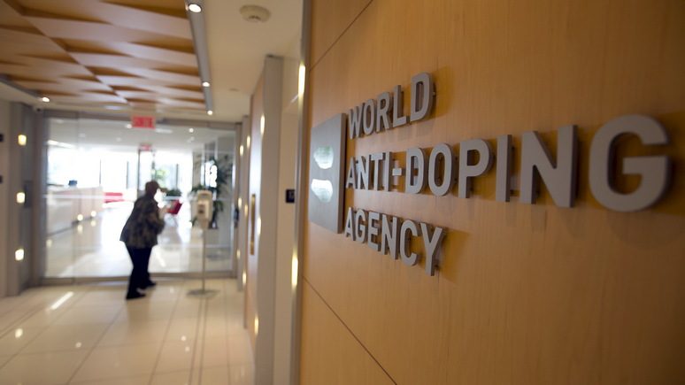 a-woman-walks-into-the-head-offices-for-wada-in-montreal